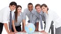 Serious business team around a terrestrial globe Royalty Free Stock Photo