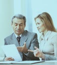 Serious business team with tablet pc computers, documents having discussion in the office Royalty Free Stock Photo