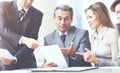 Serious business team with tablet pc computers, documents having discussion in the office Royalty Free Stock Photo