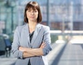 Serious business woman in gray suit standing in the city Royalty Free Stock Photo