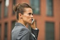 Serious business woman talking cell phone Royalty Free Stock Photo