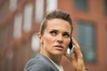 Serious business woman talking cell phone Royalty Free Stock Photo