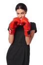 Serious business woman wearing boxing gloves Royalty Free Stock Photo