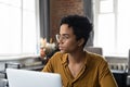 Serious business woman wearing eyeglasses, sitting at office workplace Royalty Free Stock Photo