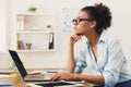 Serious business woman working on laptop at office Royalty Free Stock Photo