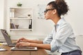 Serious business woman working on laptop at office Royalty Free Stock Photo