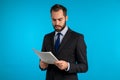 Serious businessman boss isolated on blue background studio. Man is unsatisfied Royalty Free Stock Photo