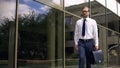 Serious businessman with briefcase going to work, purposeful and successful Royalty Free Stock Photo