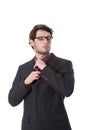 Serious businessman checking his tie Royalty Free Stock Photo