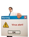 Serious businessman with computer virus alert Royalty Free Stock Photo