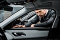 serious businessman in eyeglasses choosing car Royalty Free Stock Photo