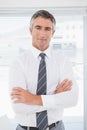 Serious businessman with folded arms Royalty Free Stock Photo