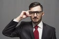 Serious businessman in formal suit and glasses