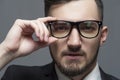 Serious businessman in formal suit and glasses