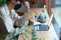 Serious business man holding glasses and working with laptop computer. Royalty Free Stock Photo