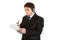 Serious businessman making notes in document Royalty Free Stock Photo