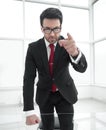 Serious businessman pointing his finger at you while standing in his office. Royalty Free Stock Photo