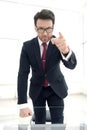 serious businessman pointing his finger at you while standing in his office. Royalty Free Stock Photo