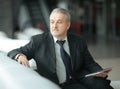 Serious businessman sitting in an office chair.people and technology Royalty Free Stock Photo