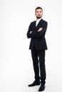 Serious businessman standing with arms folded Royalty Free Stock Photo