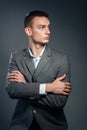 Serious businessman standing with arms folded Royalty Free Stock Photo