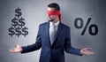 Man with ribbon on his eye holding dollar signs Royalty Free Stock Photo