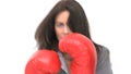 Serious businesswoman with boxing gloves