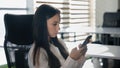 Serious businesswoman browsing phone in office Caucasian calm confident girl boring business woman typing chatting in Royalty Free Stock Photo