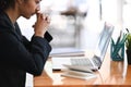 Serious businesswoman concentrate working laptop in office.