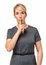 Serious Businesswoman Making Shhh Gesture