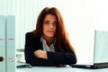 Serious businesswoman sitting at the table Royalty Free Stock Photo
