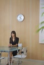 Serious Businesswoman At Table In Office Royalty Free Stock Photo