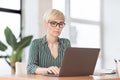 Serious Businesswoman Using Laptop Working In Modern Office Royalty Free Stock Photo