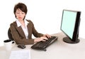 Serious Businesswoman Working at a Computer Royalty Free Stock Photo