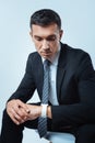 Serious busy businessman looking at his watch Royalty Free Stock Photo