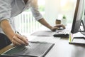 Serious busy hipster young web software developer programmer is coding or programming on a desktop computer information in modern Royalty Free Stock Photo