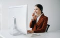 Serious call center operator in wireless headset talking with customer, woman in headphones with microphone consulting client on Royalty Free Stock Photo