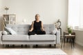 Serious calm middle aged woman meditating at home Royalty Free Stock Photo