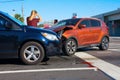 Serious bad car wreck at intersection with very upset man driver looking at damage Royalty Free Stock Photo
