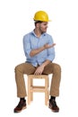 Serious casual man wearing hard hat, disagreeing and gesturing Royalty Free Stock Photo