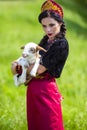 Serious Caucasian Model in Russian Style Kokoshnik Holding Newborn Lamb Cub Against Nature Background Royalty Free Stock Photo