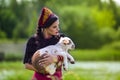 Serious Caucasian Model in Russian Style Kokoshnik Holding Newborn Lamb Cub Against Nature Background Royalty Free Stock Photo