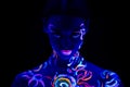 Serious caucasian woman with fluorescent prints on skin Royalty Free Stock Photo