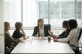 Serious ceo leading corporate team meeting talking to multiracia Royalty Free Stock Photo