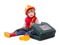 Serious child in hardhat with working tools Royalty Free Stock Photo