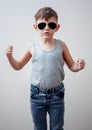 Serious child making symbols with fingers Royalty Free Stock Photo