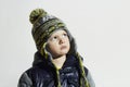 Serious child.winter fashion kids.fashionable little boy in cap Royalty Free Stock Photo