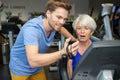 Serious coach giving instruction to female senior working out Royalty Free Stock Photo