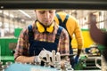 Production worker writing in clipboard Royalty Free Stock Photo