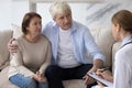 Serious concerned old retired couple consulting family doctor Royalty Free Stock Photo